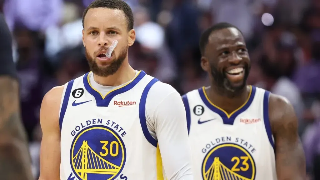 Stephen Curry #30 of the Golden State Warriors and Draymond Green #23 react during the fourth quarter in game seven of the Western Conference First Round Playoffs against the Sacramento Kings at Golden 1 Center on April 30, 2023 in Sacramento, California.