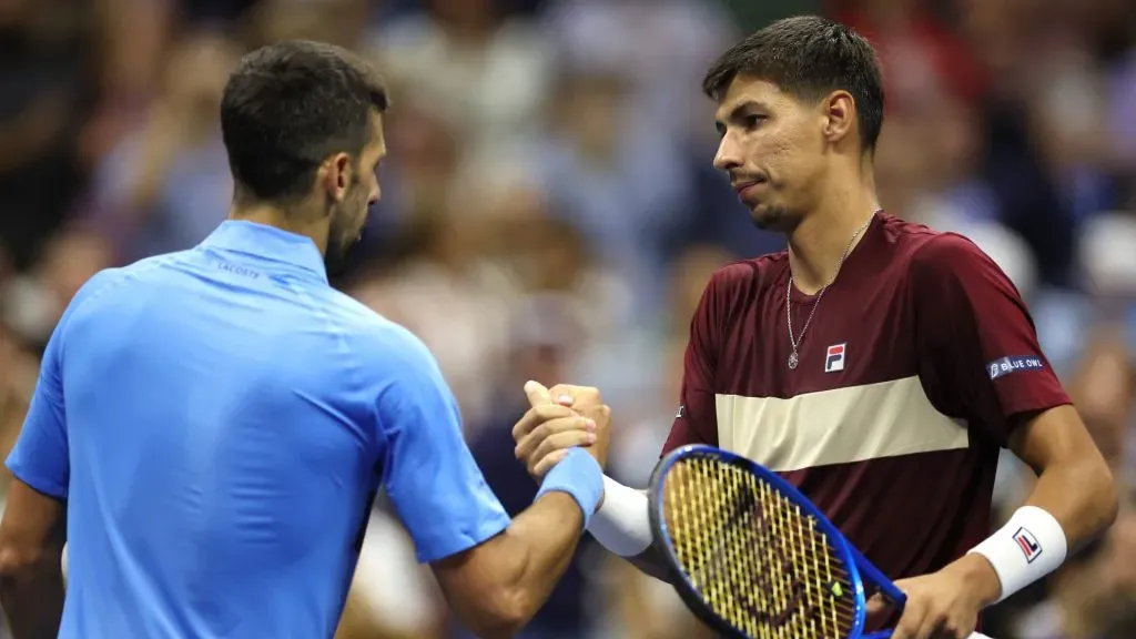 Alexei Popyrin of Australia shakes hands with Novak Djokovic of Serbia after winning their Men’s Singles Third Round match on Day Five of the 2024 US Open. Sarah Stier/Getty Images