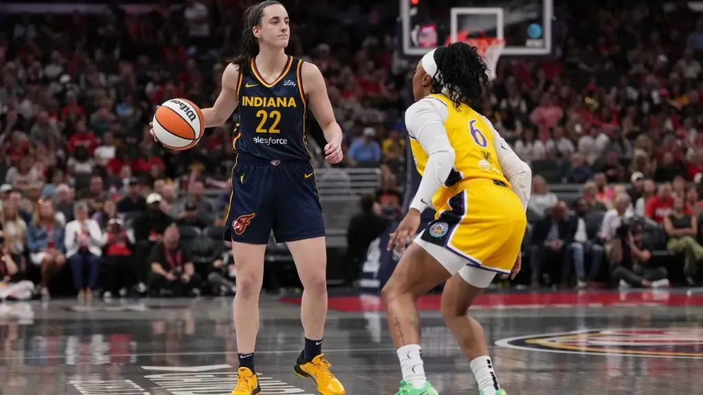 Caitlin Clark #22 of the Indiana Fever looks for an opening against Odyssey Sims #6 of the Los Angeles Sparks in the third quarter at Gainbridge Fieldhouse on September 04, 2024 in Indianapolis, Indiana. (Photo by Dylan Buell/Getty Images)