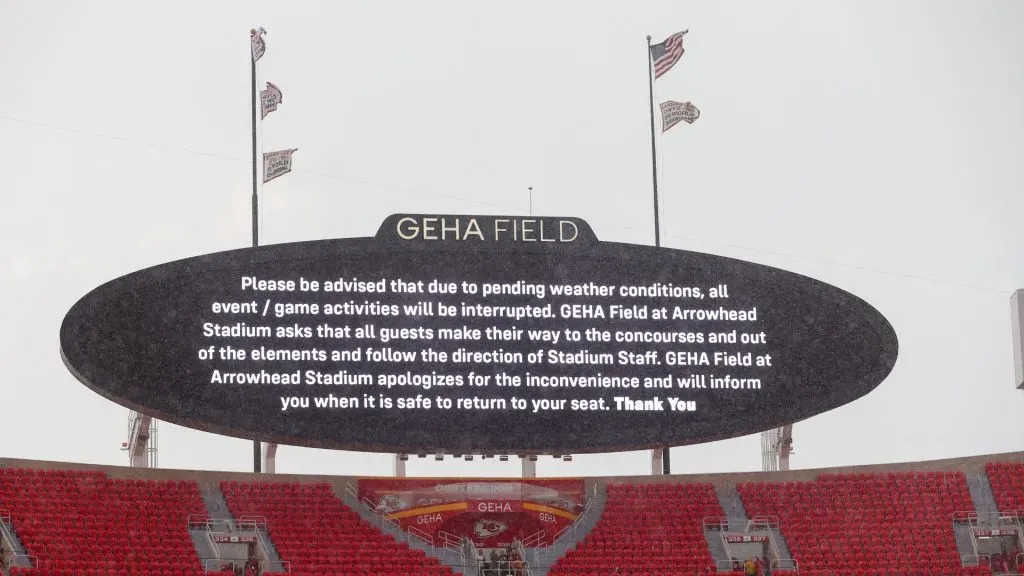 Signage is seen on the field as it rains during a delay due to inclement weather prior to the Kansas City Chiefs taking on the Baltimore Ravens at GEHA Field at Arrowhead Stadium on September 05, 2024 in Kansas City, Missouri.