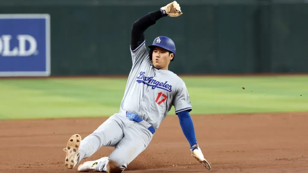 Shohei Ohtani #17 of the Los Angeles Dodgers safely steals third base during the seventh inning against the Arizona Diamondbacks at Chase Field. (Photo by Chris Coduto/Getty Images)