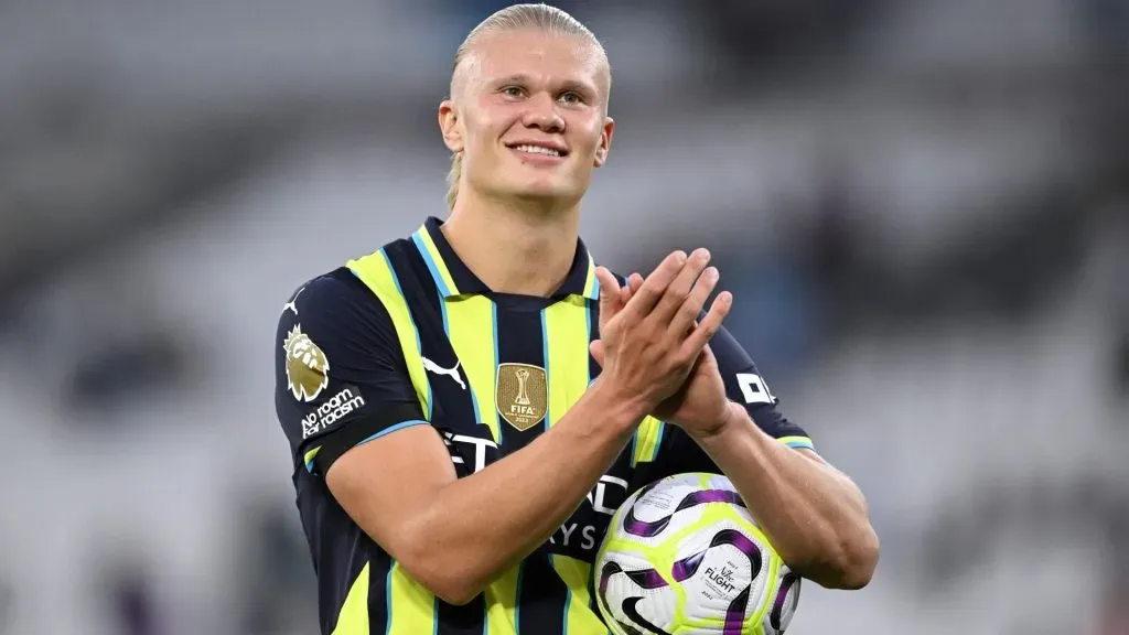 Erling Haaland of Manchester City celebrates with the match ball after scoring a hat-trick during the Premier League match between West Ham United FC and Manchester City FC. (Photo by Justin Setterfield/Getty Images)