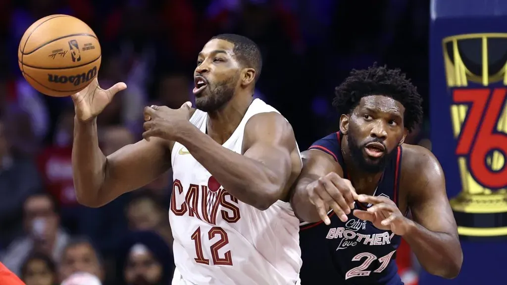 Tristan Thompson #12 of the Cleveland Cavaliers and Joel Embiid #21 of the Philadelphia 76ers challenge for the ball during the first quarter at the Wells Fargo Center on November 21, 2023 in Philadelphia, Pennsylvania. (Photo by Tim Nwachukwu/Getty Images)