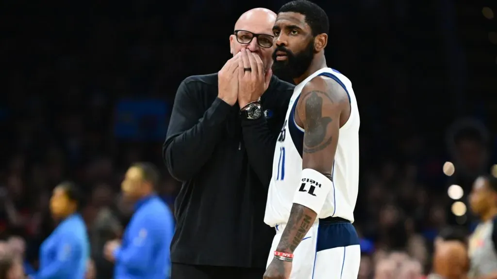 Head coach Jason Kidd of the Dallas Mavericks talks with Kyrie Irving #11 during the second quarter against the Oklahoma City Thunder. Joshua Gateley/Getty Images