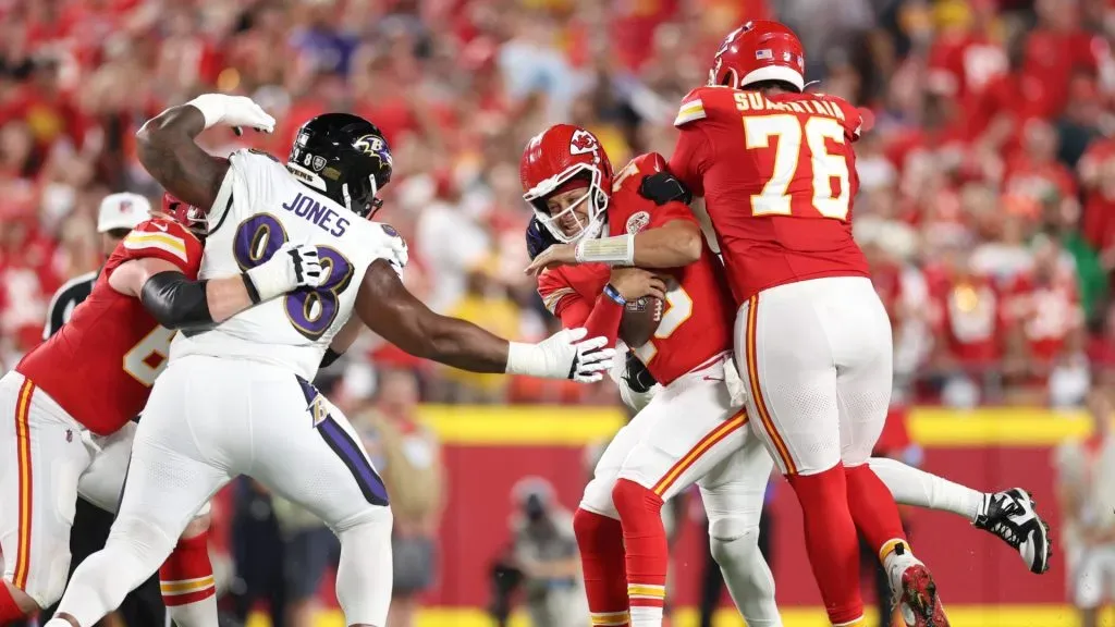 Quarterback Patrick Mahomes #15 of the Kansas City Chiefs against Travis Jones #98 of the Baltimore Ravens during the first quarter at GEHA Field at Arrowhead Stadium on September 05, 2024 in Kansas City, Missouri.