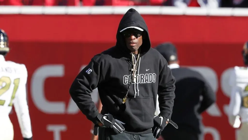 Deion Sanders head coach of the Colorado Buffaloes watches warmups before their game against the Utah Utes at Rice Eccles Stadium on November 25, 2023 in Salt Lake City, Utah.