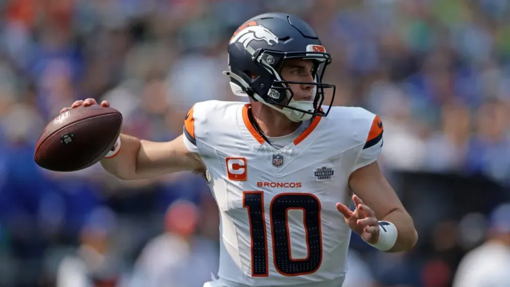 Bo Nix #10 of the Denver Broncos attempts a pass during the first quarter against the Seattle Seahawks at Lumen Field on September 08, 2024 in Seattle, Washington.