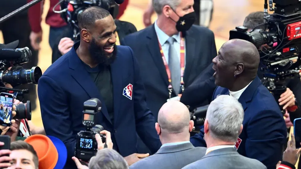 Michael Jordan and LeBron James interact after the presentation of the NBA 75th Anniversary Team during the 2022 NBA All-Star Game at Rocket Mortgage Fieldhouse on February 20, 2022 in Cleveland, Ohio. (Photo by Jason Miller/Getty Images)