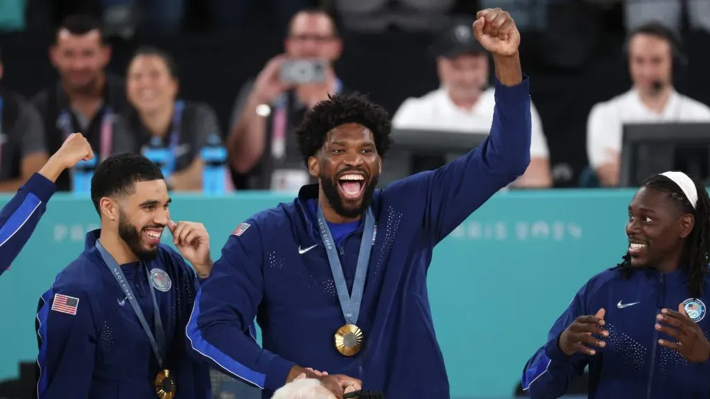 Gold medalist Joel Embiid #11 of Team United States celebrates on the podium during the Men’s basketball medal ceremony on day fifteen of the Olympic Games Paris 2024. (Photo by Jamie Squire/Getty Images)