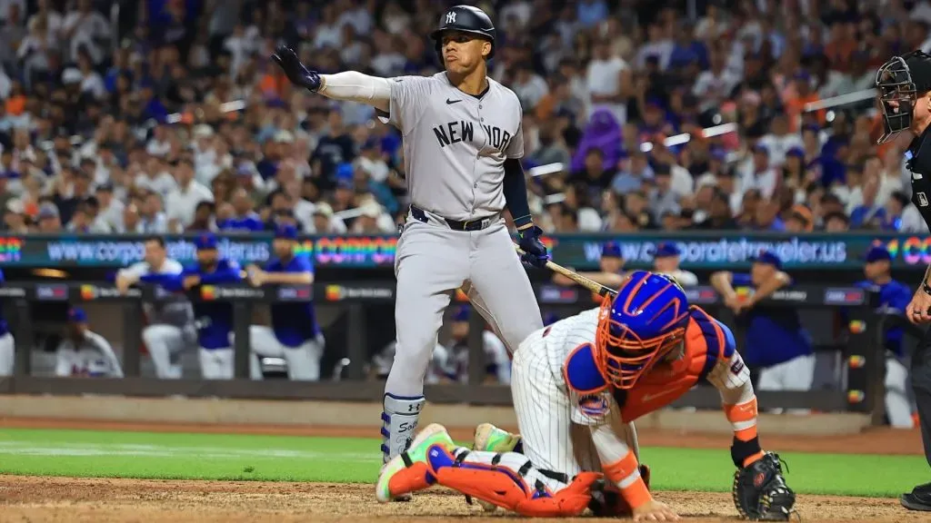 uan Soto 22 of the New York Yankees is signaling to teammate Austin Wells not to advance on a pitch during the eighth inning of the baseball game against the New York Mets. IMAGO / NurPhoto.