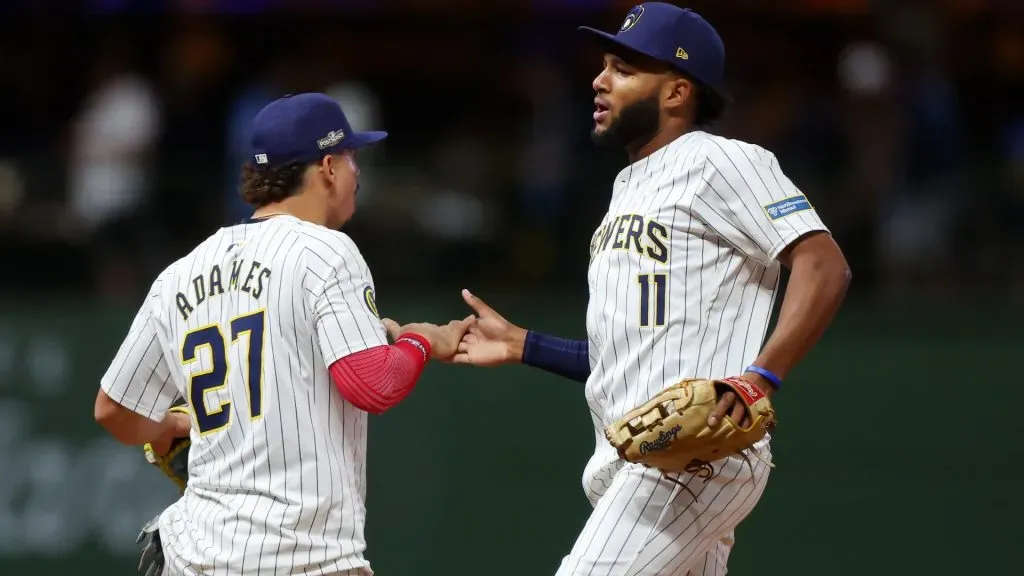 Willy Adames #27 and Jackson Chourio #11 of the Milwaukee Brewers celebrate after beating the New York Mets 5-3 in Game Two of the Wild Card Series at American Family Field on October 02, 2024 in Milwaukee, Wisconsin. (Photo by Stacy Revere/Getty Images)