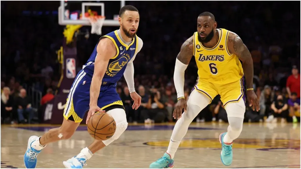 Stephen Curry of the Golden State Warriors dribbles past LeBron James of the Los Angeles Lake – Harry How/Getty Images