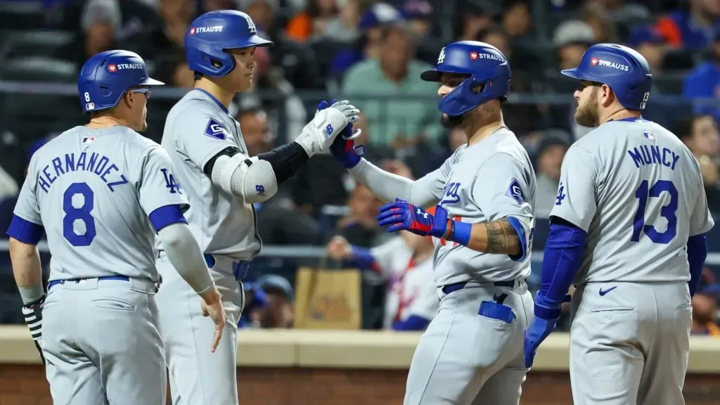 Andy Pages #44 of the Los Angeles Dodgers high-fives Shohei Ohtani #17 after hitting a three-run home run in the fifth inning against the New York Mets during Game Five of the National League Championship Series at Citi Field on October 18, 2024 in New York City. (Photo by Al Bello/Getty Images)