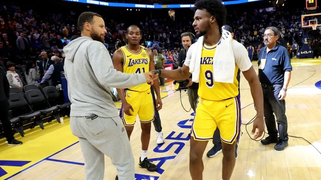 Stephen Curry #30 of the Golden State Warriors talks with Bronny James #9 of the Los Angeles Lakers after their preseason game at Chase Center on October 18, 2024 in San Francisco, California.