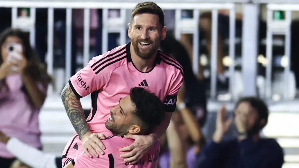 Lionel Messi #10 of Inter Miami celebrates with Jordi Alba #18 after scoring his second goal during the second half against the New England Revolution at Chase Stadium on October 19, 2024 in Fort Lauderdale, Florida. 