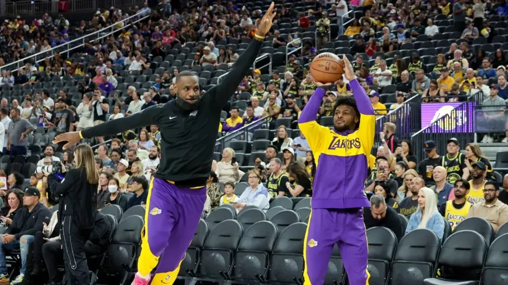 LeBron James (L) #23 of the Los Angeles Lakers blocks a 3-point shot by his son Bronny James #9 of the Lakers as they warm up before a preseason game against the Golden State Warriors at T-Mobile Arena at T-Mobile Arena on October 15, 2024 in Las Vegas, Nevada. The Warriors defeated the Lakers 111-97. 