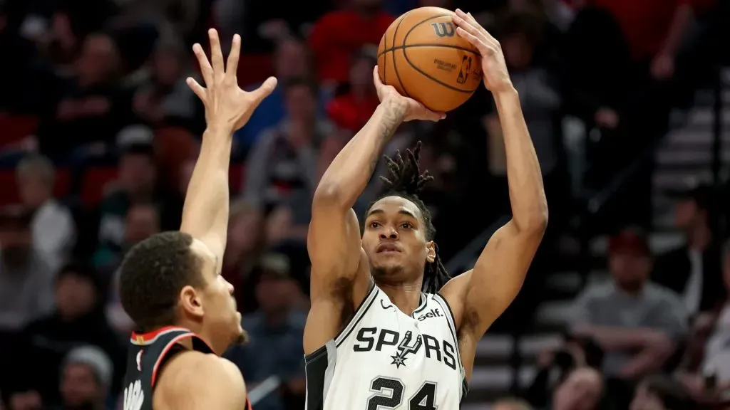 Devin Vassell #24 of the San Antonio Spurs shoots against the Portland Trail Blazers during the third quarter at Moda Center on December 28, 2023 in Portland, Oregon.