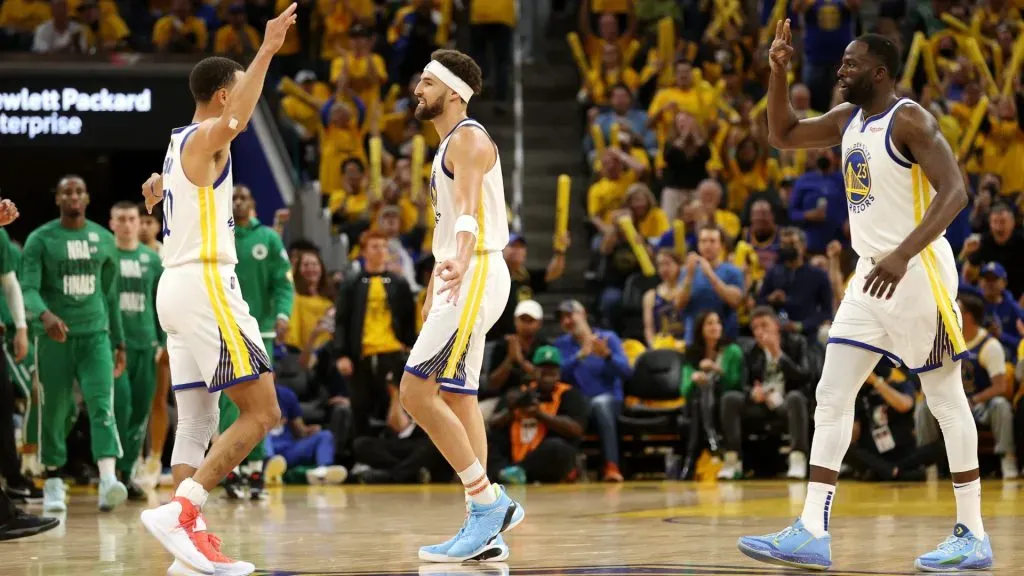 Stephen Curry #30, Klay Thompson #11 and Draymond Green #23 of the Golden State Warriors celebrates during the third quarter against the Boston Celtics in Game Two of the 2022 NBA Finals at Chase Center on June 05, 2022 in San Francisco, California. 