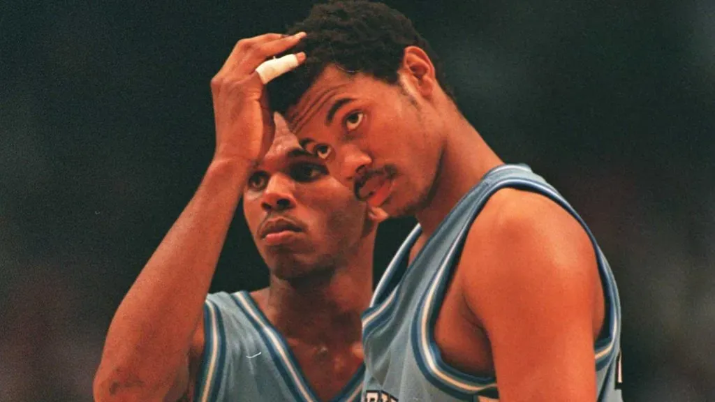 Jerry Stackhouse #42 rubs the head of Rasheed Wallace #30 both of North Caroline during the final minute of the Southeast Regional Final against Kentucky in 1995. (Source: Getty Images)