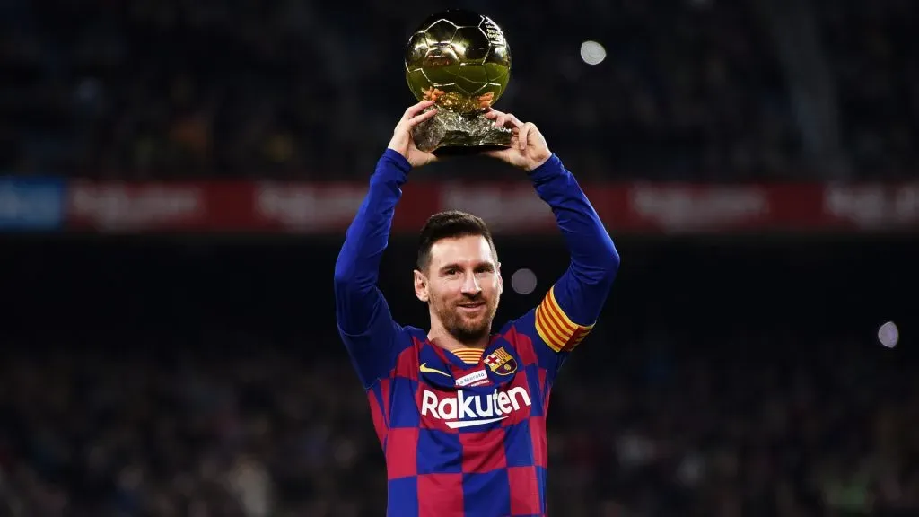 Lionel Messi of FC Barcelona lifts up his sixth Ballon d’Or prior to the Liga match between FC Barcelona and RCD Mallorca at Camp Nou. (Alex Caparros/Getty Images)