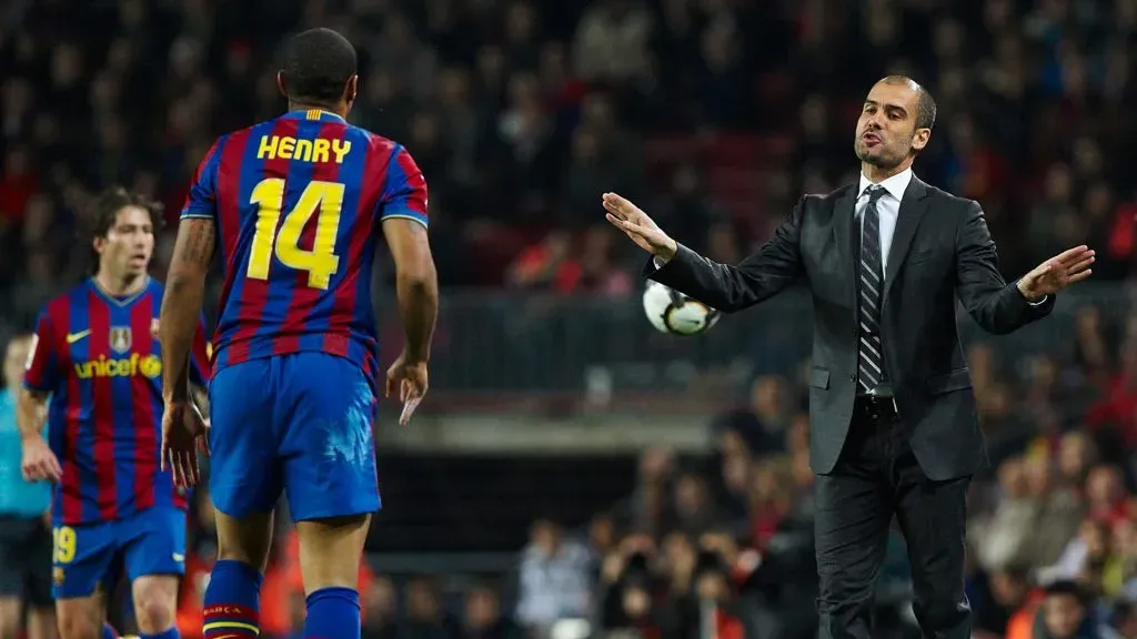Barcelona manager Josep Guardiola gives instructions to his player Thierry Henry during the La Liga match between Barcelona and Osasuna. (Manuel Queimadelos Alonso/Getty Images)