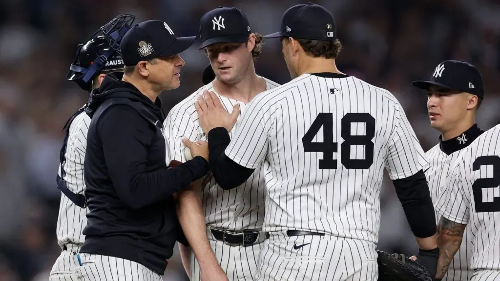 Manager Aaron Boone #17 of the New York Yankees relieves starting pitcher Gerrit Cole #45 during the seventh inning of Game Five of the 2024 World Series against the Los Angeles Dodgers at Yankee Stadium on October 30, 2024 in the Bronx borough of New York City. (Photo by Elsa/Getty Images)