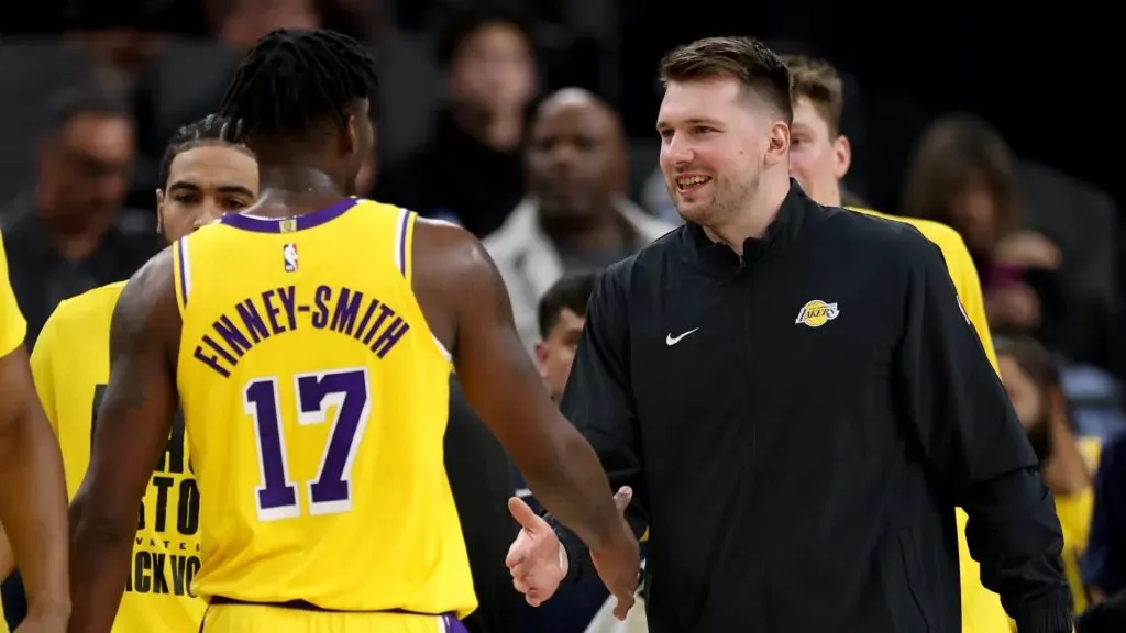 Luka Doncic #77 of the Los Angeles Lakers celebrates a lead with Dorian Finney-Smith #17 during a 122-97 Lakers win over the LA Clippersat Intuit Dome. (Harry How/Getty Images)