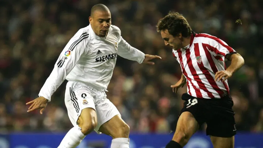 Ronaldo of Real Madrid dribbles the ball past Ander Murillo of Athletic Bilbao during a match on February 11, 2006.