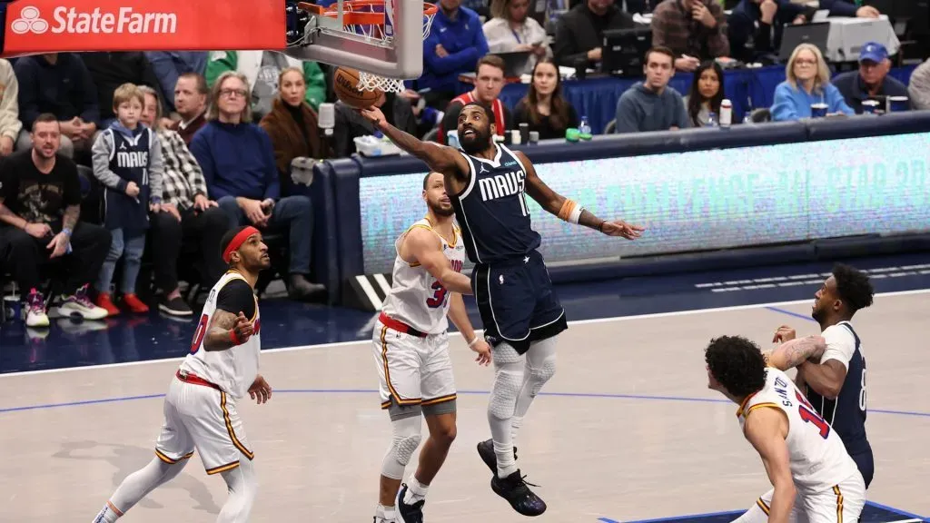 Kyrie Irving #11 of the Dallas Mavericks drives to the basket against Stephen Curry #30 of the Golden State Warriors during the fourth quarter at American Airlines Center on February 12, 2025 in Dallas, Texas. (Photo by Sam Hodde/Getty Images)