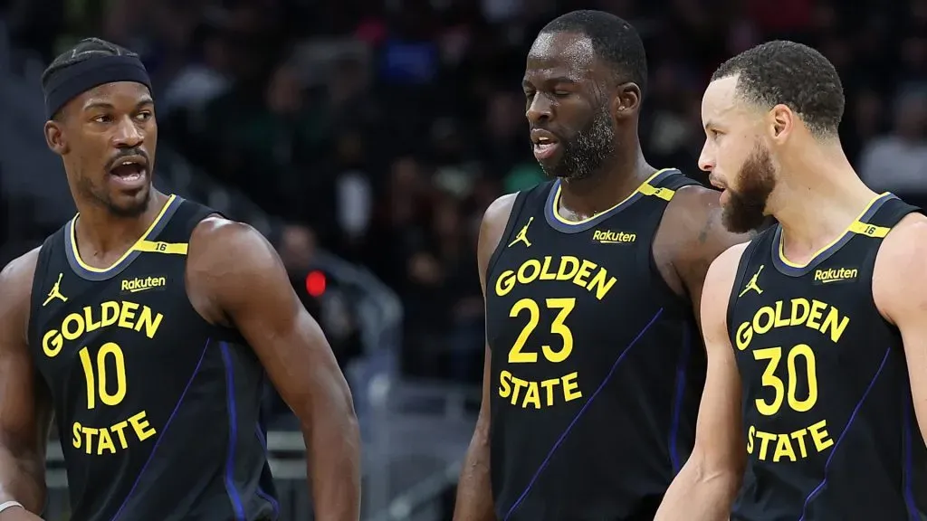 Jimmy Butler #10, Draymond Green #23 and Stephen Curry #30 of the Golden State Warriors walk backcourt during a game against the Milwaukee Bucks. (Stacy Revere/Getty Images)