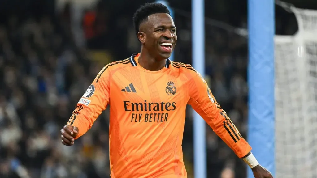 Vinicius Junior of Real Madrid laughs during the UEFA Champions League 2024/25 League Knockout Play-off first leg match between Manchester City and Real Madrid C.F. in 2025. (Source: Michael Regan/Getty Images)