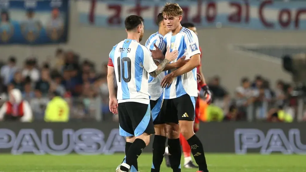 Lionel Messi of Argentina greets teammate Nico Paz after winning the FIFA World Cup 2026 South American Qualifier match between Argentina and Bolivia at Estadio Más Monumental Antonio Vespucio Liberti on October 15, 2024 in Buenos Aires, Argentina.