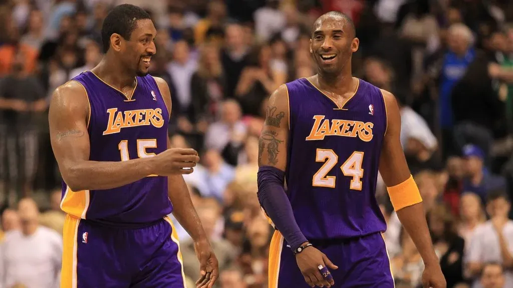 Kobe Bryant #24 and Metta Sandiford-Artest (then Ron Artest) #15 of the Los Angeles Lakers react after a win vs the Dallas Mavericks on March 12, 2011
