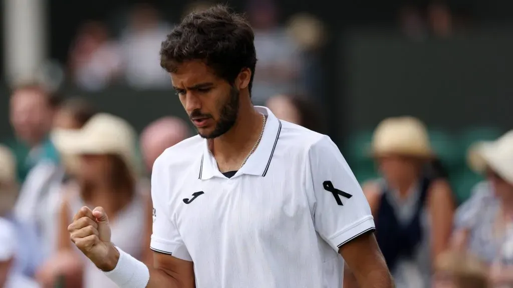 A black ribbon is worn by Francisco Cabral of Portugal during the second round match against Petr Nouza and Patrik Rikl