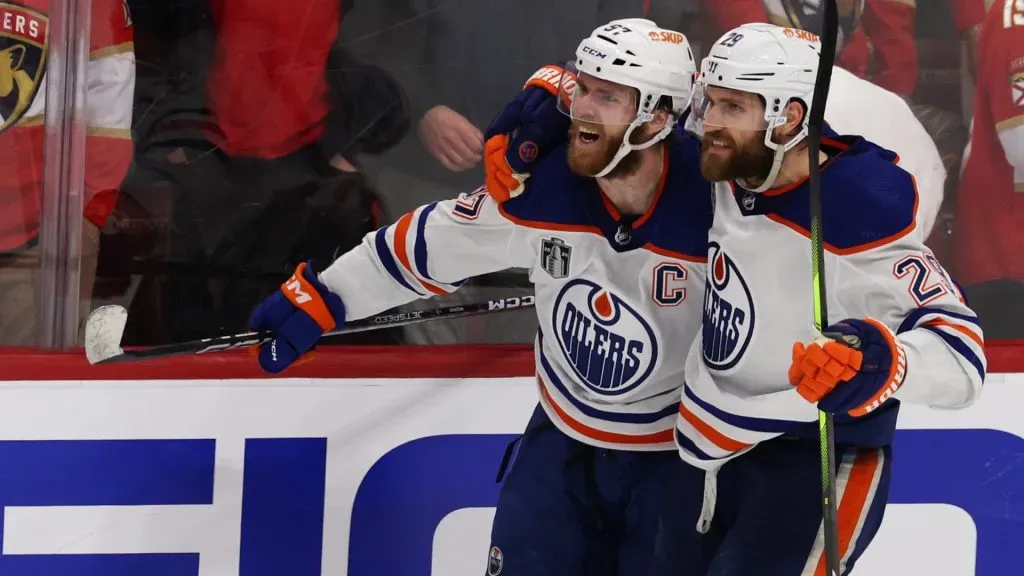 Connor McDavid #97 celebrates an empty net goal with Leon Draisaitl #29 of the Edmonton Oilers during the third period against the Florida Panthers in Game Five of the 2024 Stanley Cup Final at Amerant Bank Arena on June 18, 2024 in Sunrise, Florida. (Photo by Elsa/Getty Images)