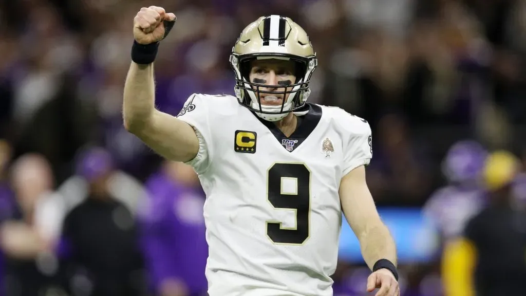 Drew Brees celebrates after throwing a touchdown pass to Taysom Hill #7 during the fourth quarter against the Minnesota Vikings in the NFC Wild Card Playoff game in 2020. (Source: Chris Graythen/Getty Images)