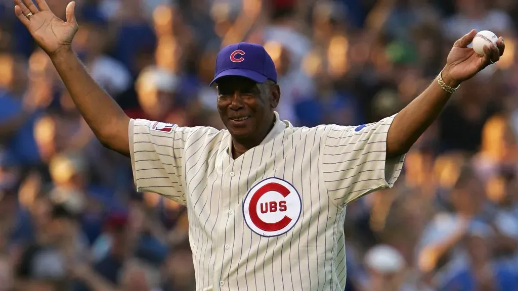 Ernie Banks acknowledges the fans prior to throwing out the ceremonial first pitch prior to Game Three of the National League Divisional Series on October 6, 2007. (Source: Chris McGrath/Getty Images)