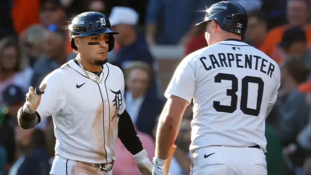 Javier Báez #28 of the Tigers celebrates with Kerry Carpenter #30 after his a two-run home run against the Mariners. Duane Burleson/Getty Images