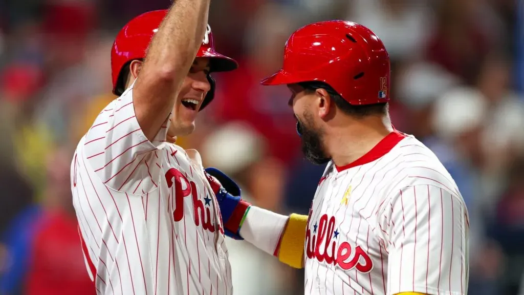 Kyle Schwarber #12 of the Phillies celebrates with J.T. Realmuto #10 (left) after hitting a solo home run. Heather Barry/Getty Images