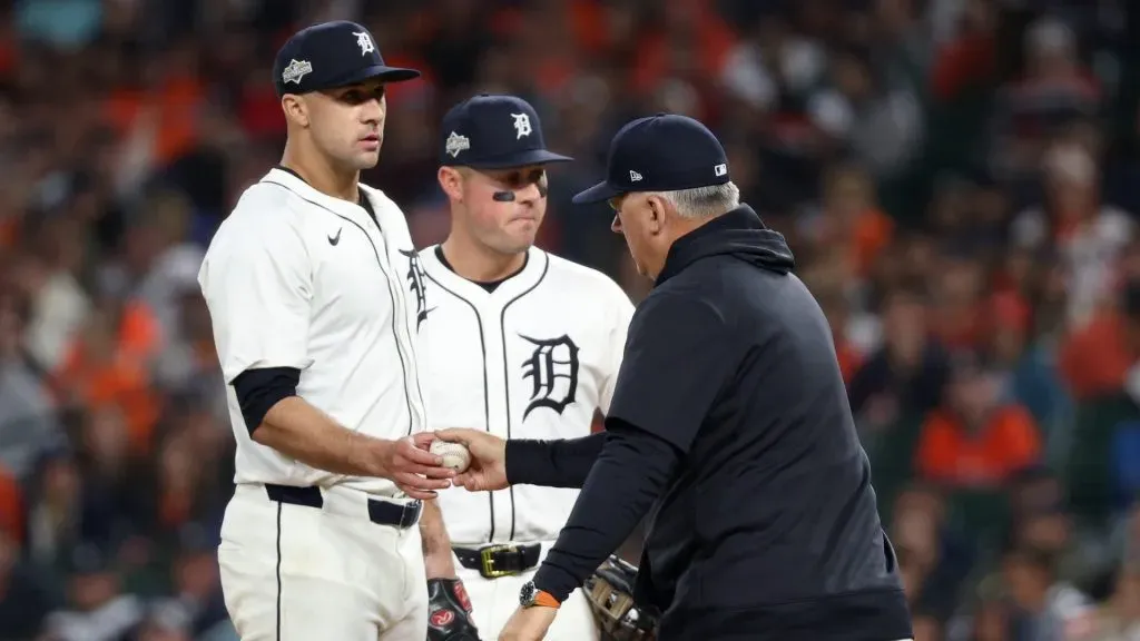 A.J. Hinch #14 of the Tigers takes the ball from Jack Flaherty #9 during a pitching change in the fourth inning against the Mariners. Mike Mulholland/Getty Images