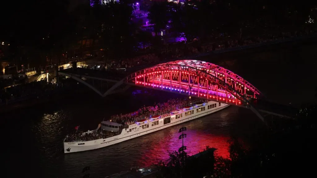 Team France passes under the Passerelle Debilly while cruising on the River Seine during the athletes’ parade during the opening ceremony of the Olympic Games Paris 2024 on July 26, 2024 in Paris, France. (Source: Ezra Shaw/Getty Images)