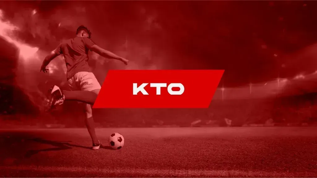 Imagem em tons de vermelho, com jogador pronto a chutar bola do lado esquerdo do campo de futebol, e logo da KTO ao centro