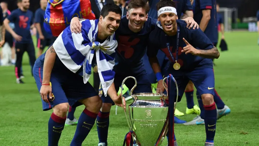 Luis Suarez, Lionel Messi and Neymar of Barcelona celebrate with the trophy after the UEFA Champions League Final between Juventus and FC Barcelona at Olympiastadion on June 6, 2015 in Berlin, Germany. 