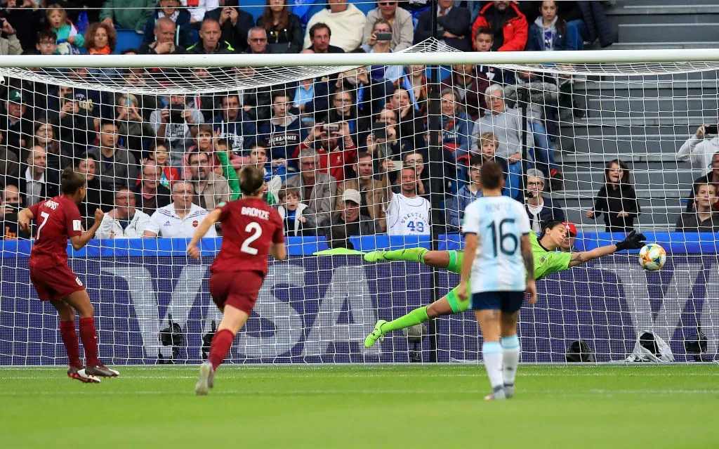 LE HAVRE, FRANCE – JUNE 14: Vanina Correa of Argentina saves a  penalty from Nikita Parris of England during the 2019 FIFA Women’s World Cup France group D match between England and Argentina at  on June 14, 2019 in Le Havre, France. (Photo by Marc Atkins/Getty Images)