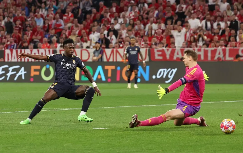 Vinicius Junior of Real Madrid and Manuel Neuer of Bayern Munich . (Photo by Alexander Hassenstein/Getty Images)
