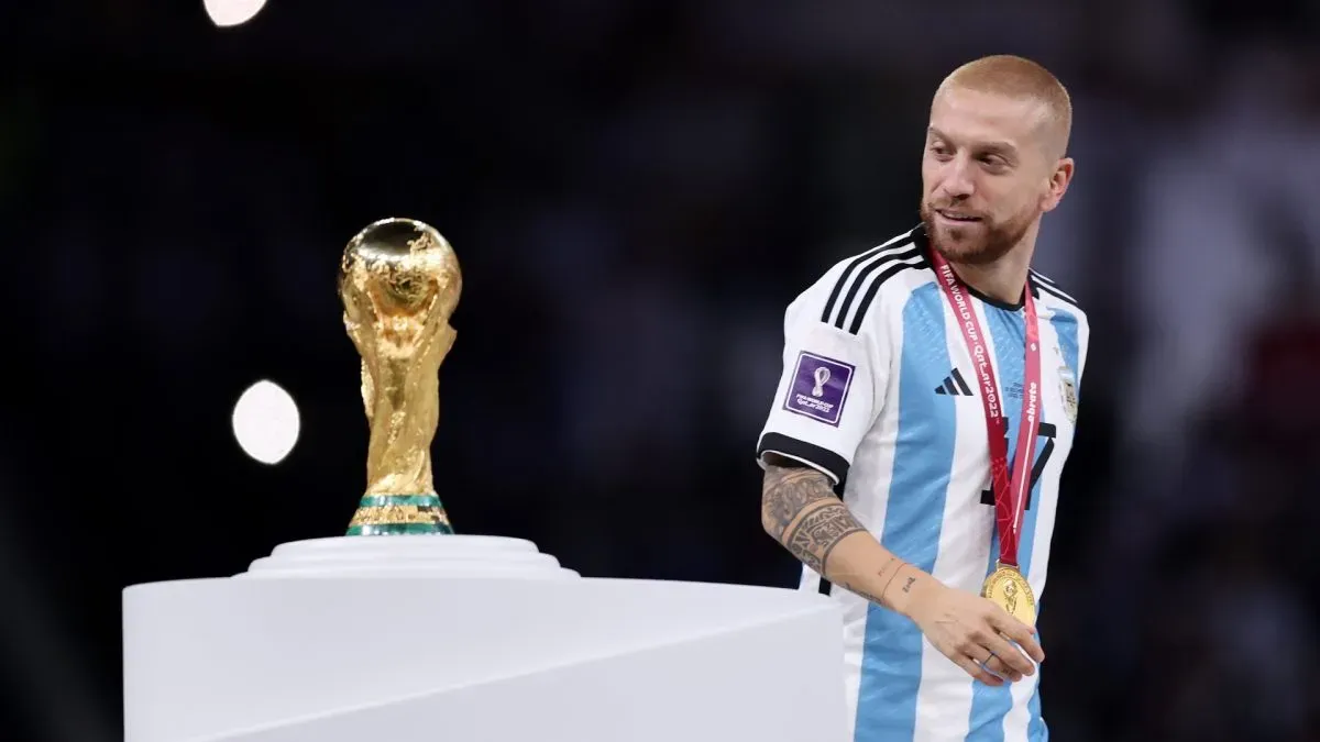 Alejandro Gomez of Argentina walks past the FIFA World Cup Qatar 2022 Winner’s Trophy.