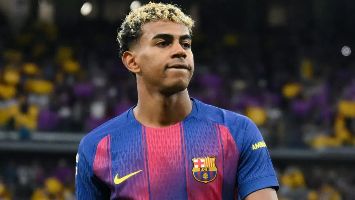 Barcelona star Lamine Yamal looking on