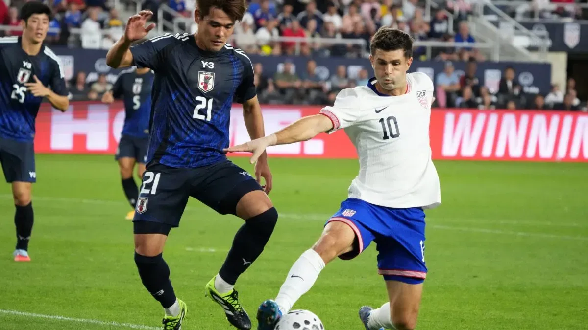 Christian Pulisic #10 of the United States in action against Japan