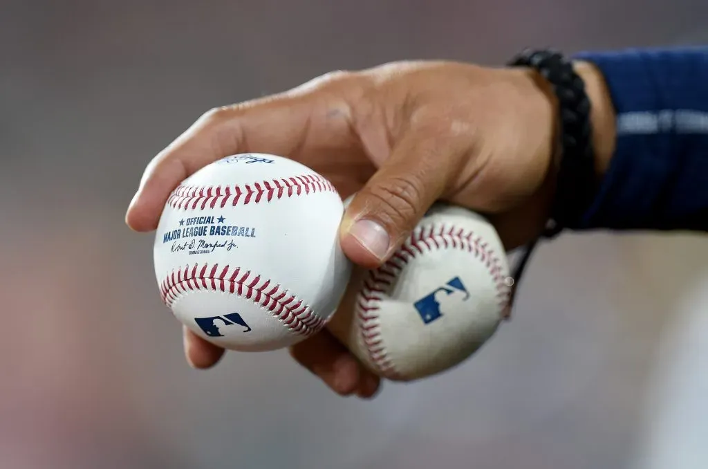 BALTIMORE, MARYLAND – APRIL 13: A Milwaukee Brewers player holds baseballs during the game against the Baltimore Orioles at Oriole Park at Camden Yards on April 13, 2022 in Baltimore, Maryland. (Photo by Greg Fiume/Getty Images)