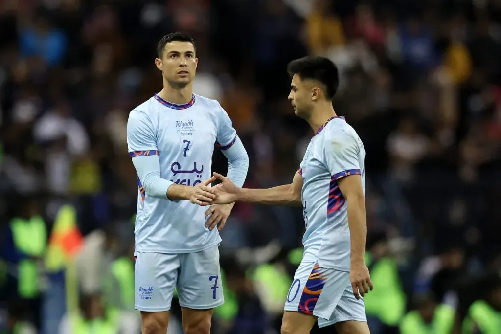 RIYADH, SAUDI ARABIA – JANUARY 19: Cristiano Ronaldo of Riyadh XI shakes hands with teammate Gonzalo Nicolas Martinez during the Winter Tour 2023 friendly between Paris Saint-Germain and Riyadh XI at King Fahd International Stadium on January 19, 2023 in Riyadh, Saudi Arabia. (Photo by Yasser Bakhsh/Getty Images)